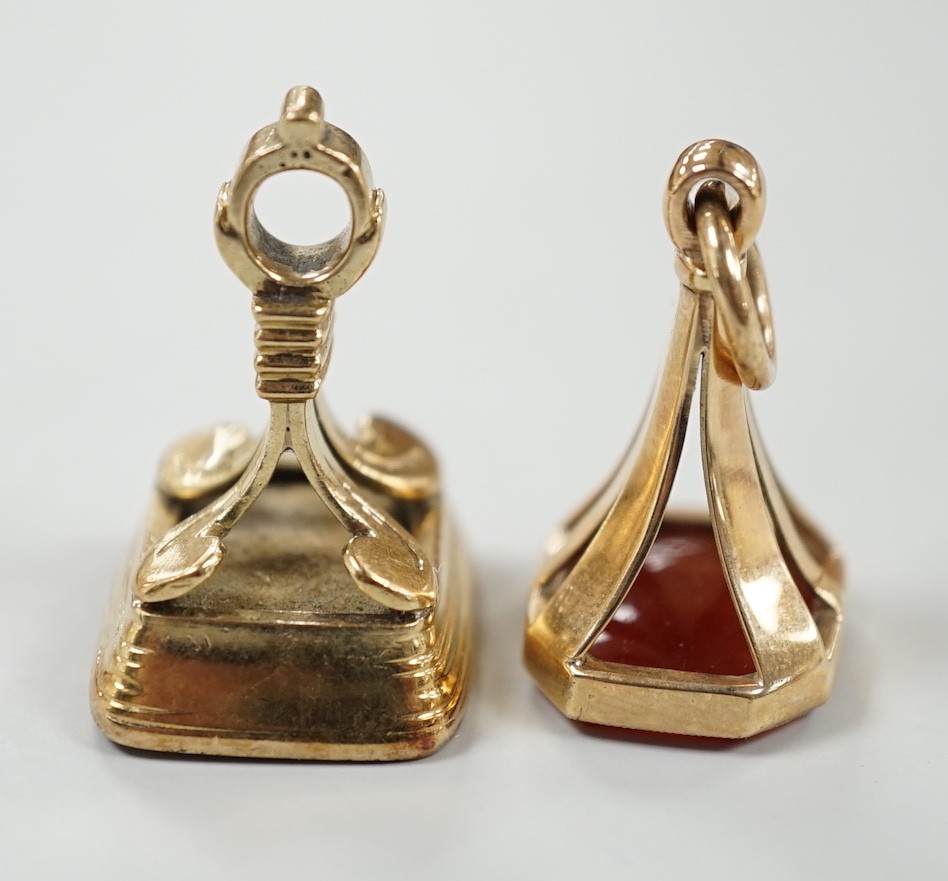 A 19th century yellow metal overlaid and white carnelian set fob seal, the matrix carved with the letter K, 27mm and a 1970's 9ct gold and carnelian set fob seal, the matrix carved with an armorial.
